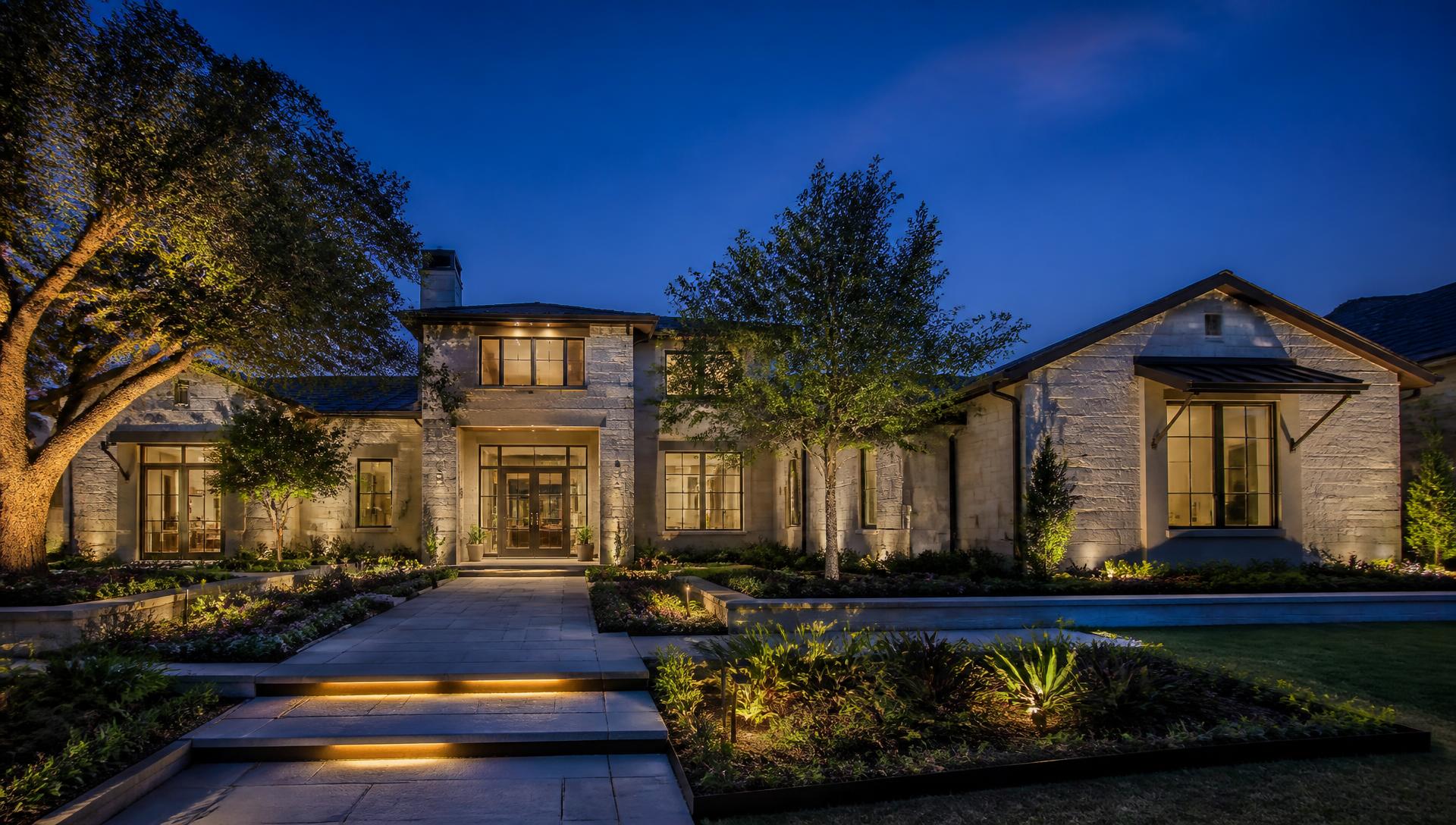 Luxury landscaped home exterior at golden hour